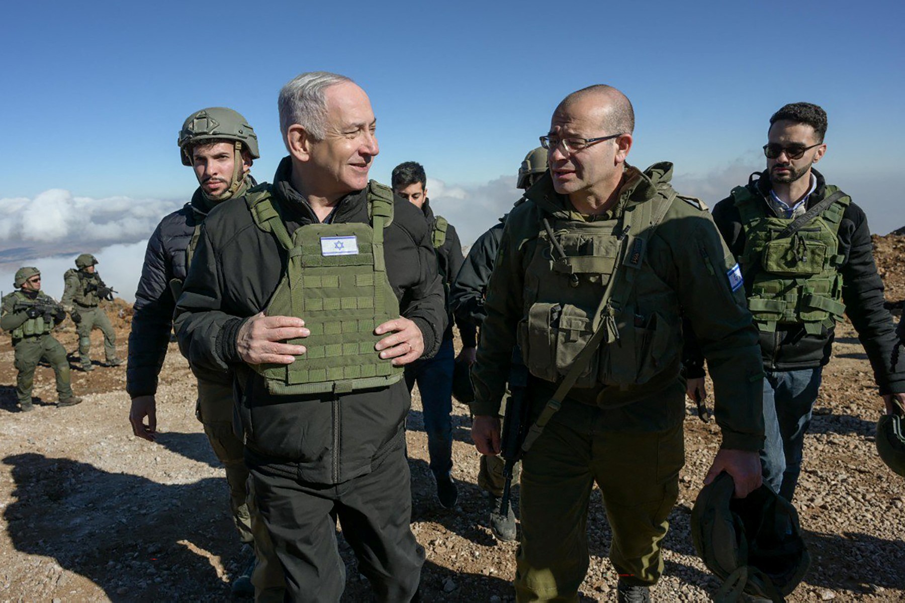 Israeli Prime Minister Benjamin Netanyahu (L) walking among members of the Israeli army at Mount Hermon in the annexed Golan Heights, Dec. 17, 2024. (File / AFP)