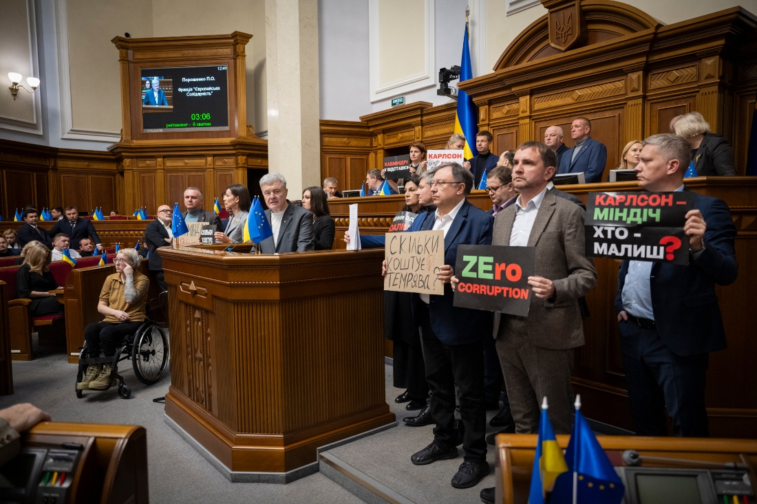 Opposition lawmakers block the parliament's rostrum in Kyiv, Ukraine. (AP)