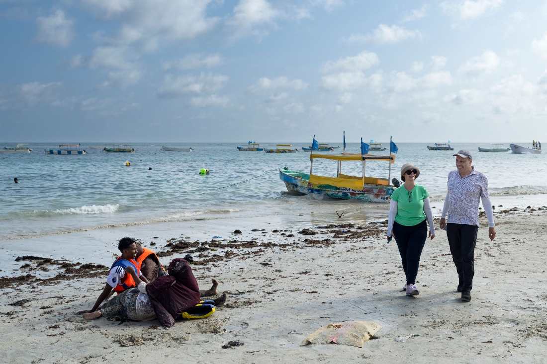 US tourists Richard and Sheryl walk on Lido beach during a guided tour of tourist attractions in Mogadishu, Somalia. (AFP)