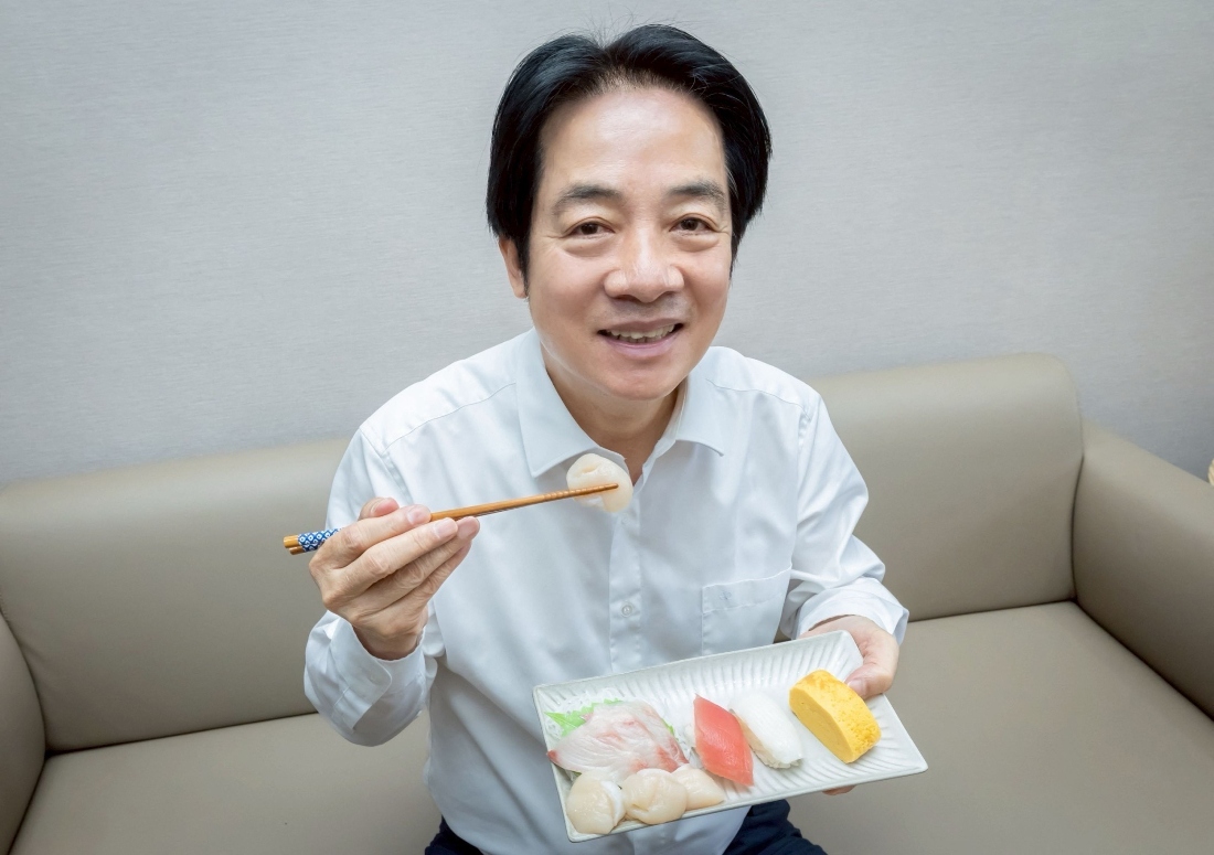 A photo of Taiwanese President Lai Ching-te holding a plate of sushi for lunch in Taipei. (Taiwan's Presidential Office)