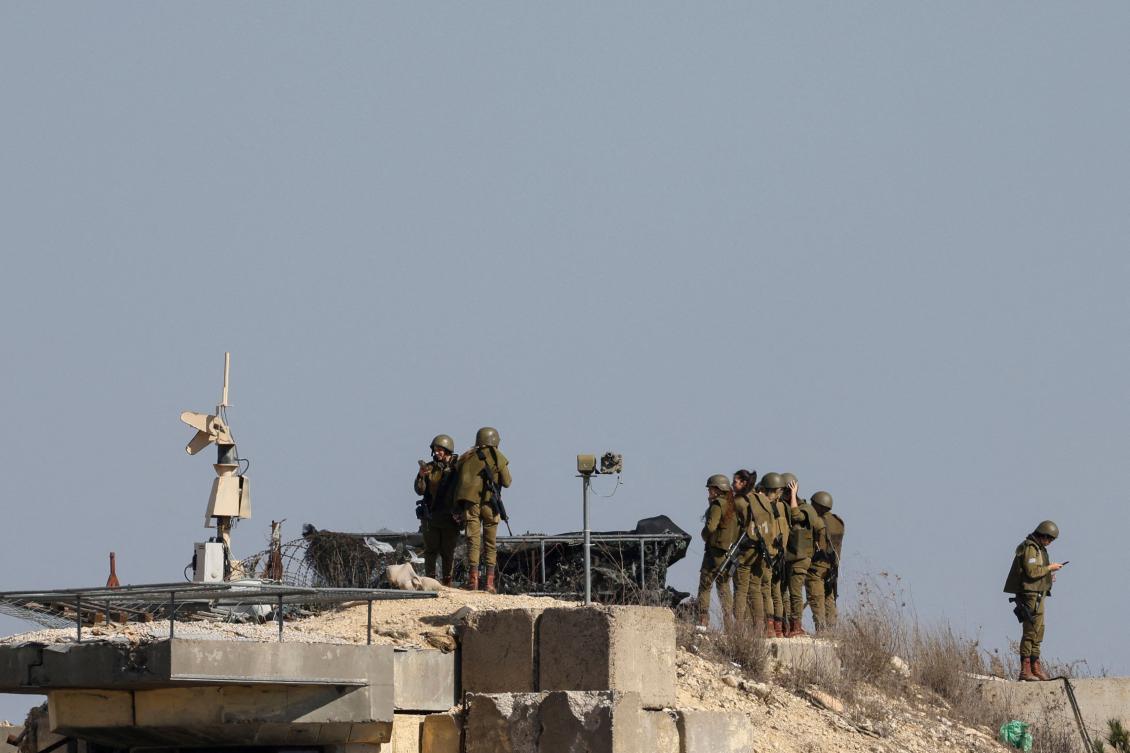 Israeli female soldiers stand on a lookout point in northern Israel near the border with Lebanon on November 19, 2025. (AFP)