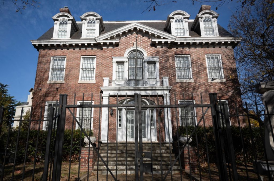 The former Syrian embassy is seen behind locked gates in Washington, DC, US. (AFP)
