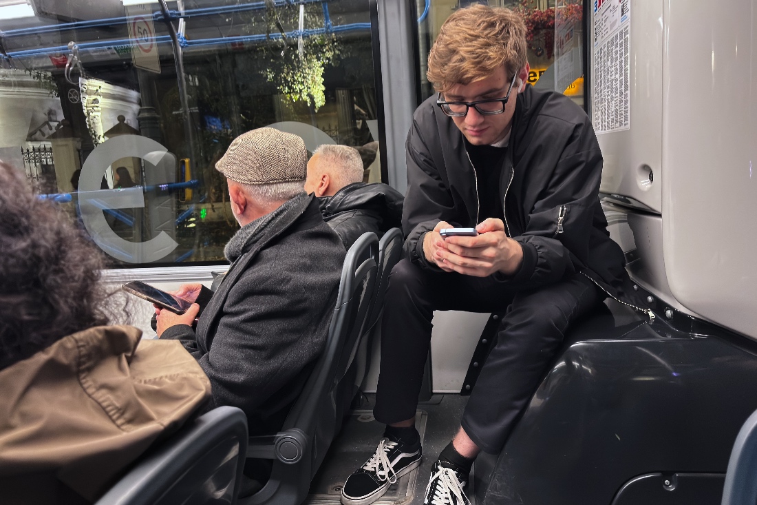 Passengers look at their smartphones on a bus in Moscow, Russia. (AP)