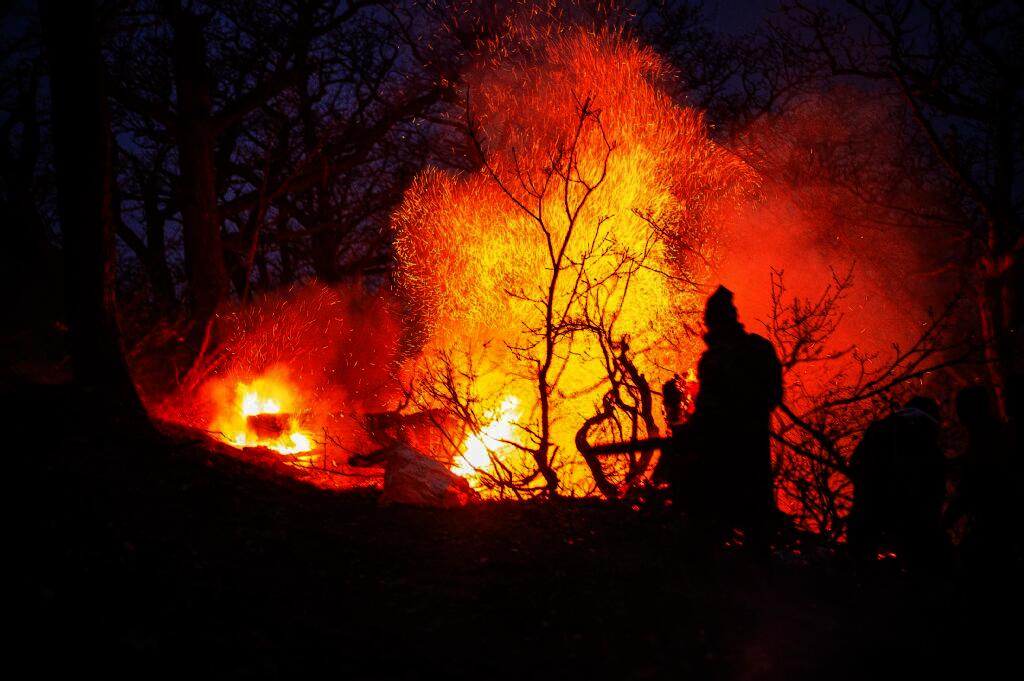 In this picture obtained from Iran's ISNA news agency, shows a view of the fire in the forests of Chalus, which has been going on for several days in Chalus on November 21, 2025. (Photo by MEHRAB FARSAD / ISNA / AFP)