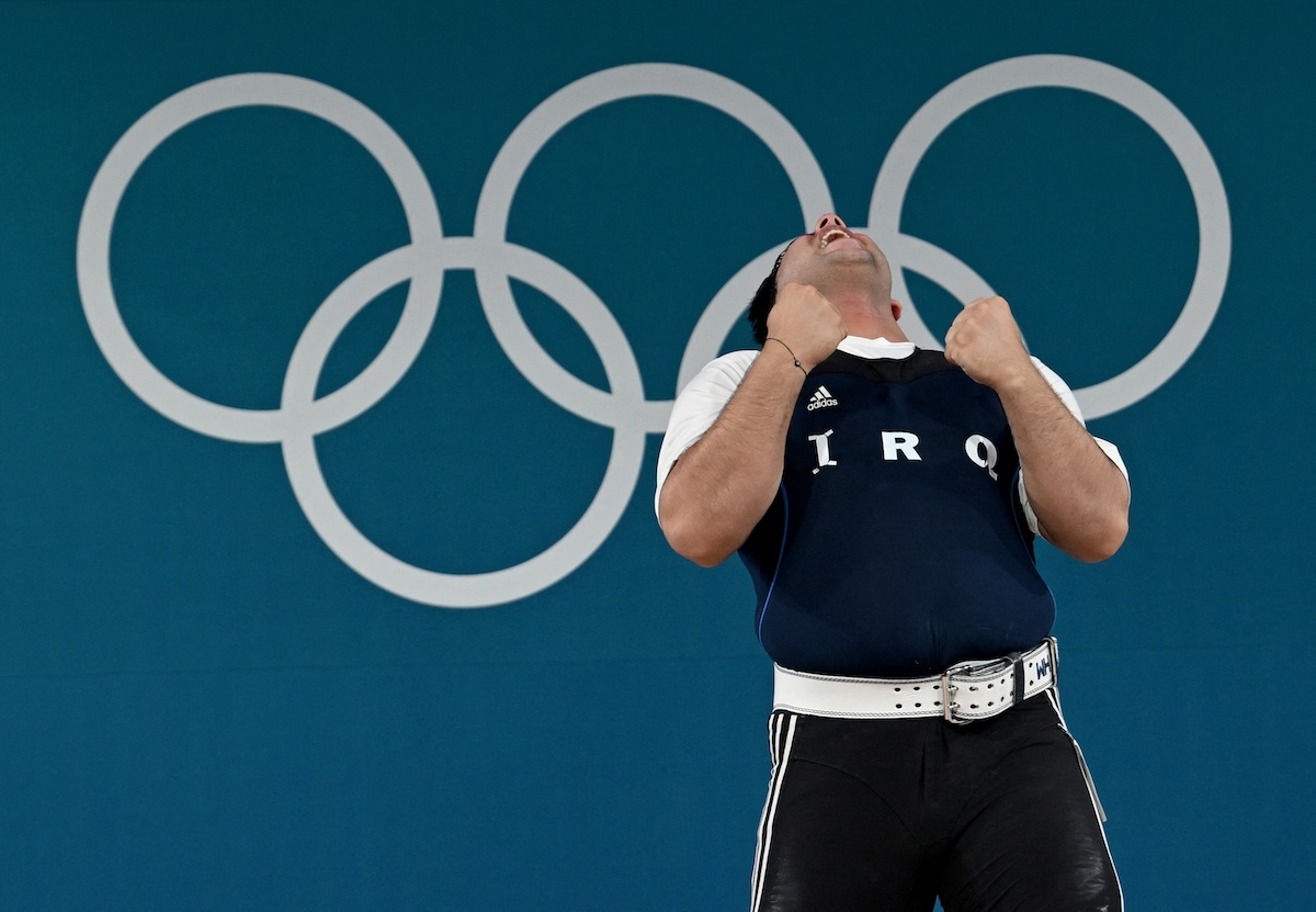Iraq's Ali Ammar Yusur Rubaiawi reacts after achieving the junior world record in the men's +102kg weightlifting event during the Paris 2024 Olympic Games at the South Paris Arena in Paris, on August 10, 2024. (FILE/AFP)