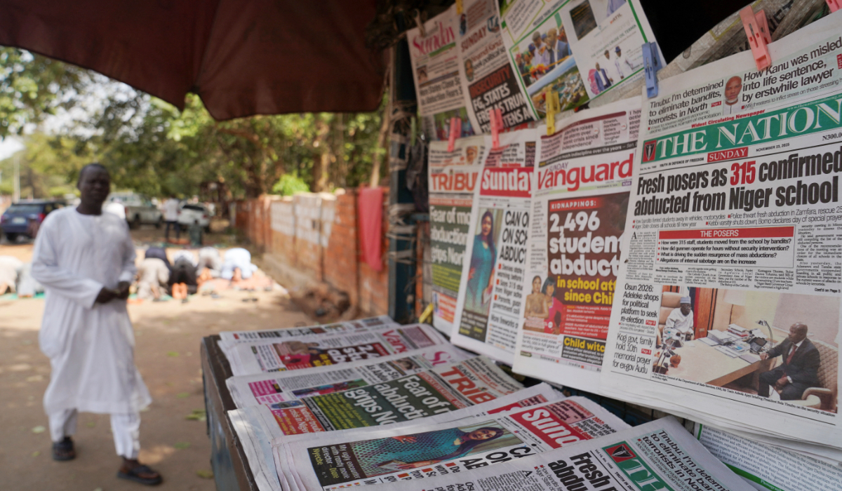 Newspapers with headlines on recent abductions are displayed at a stand in Area 1, Abuja, Nigeria, November 23, 2025. (REUTERS)