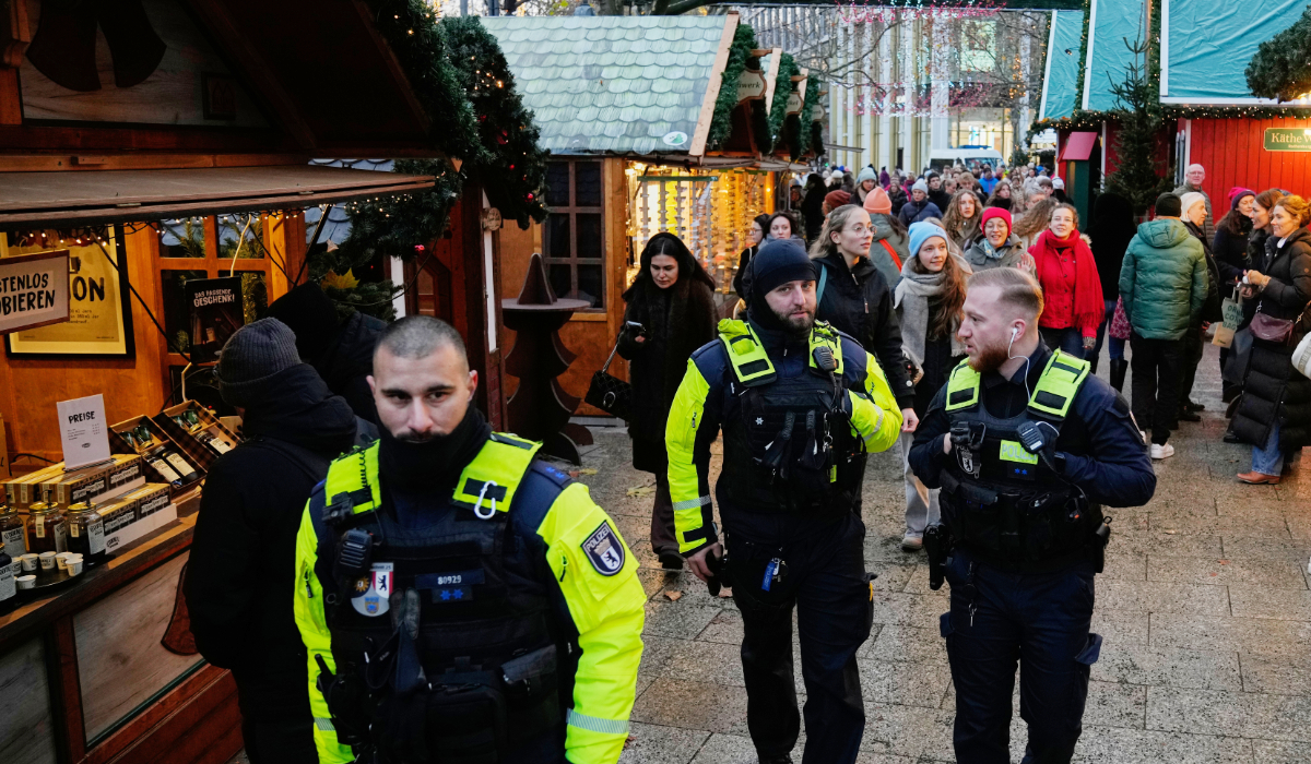 Police officers stand guard at a Christmas Market in Berlin, Germany, Monday, Nov. 24, 2025. (AP)