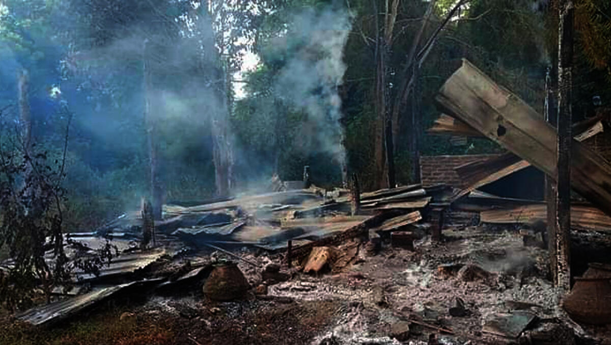 FILE - Smoke rises from debris and corrugated roofing of a school structure that was burned to the ground in Taung Myint village in the Magway region of Myanmar on Sunday, Oct. 16, 2022. (File/AP)