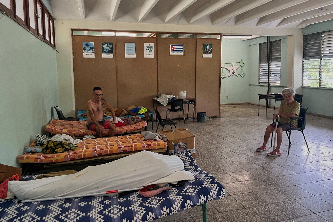 People displaced by Hurricane Melissa sit in a shelter in Los Mangos, Cuba. (AP)