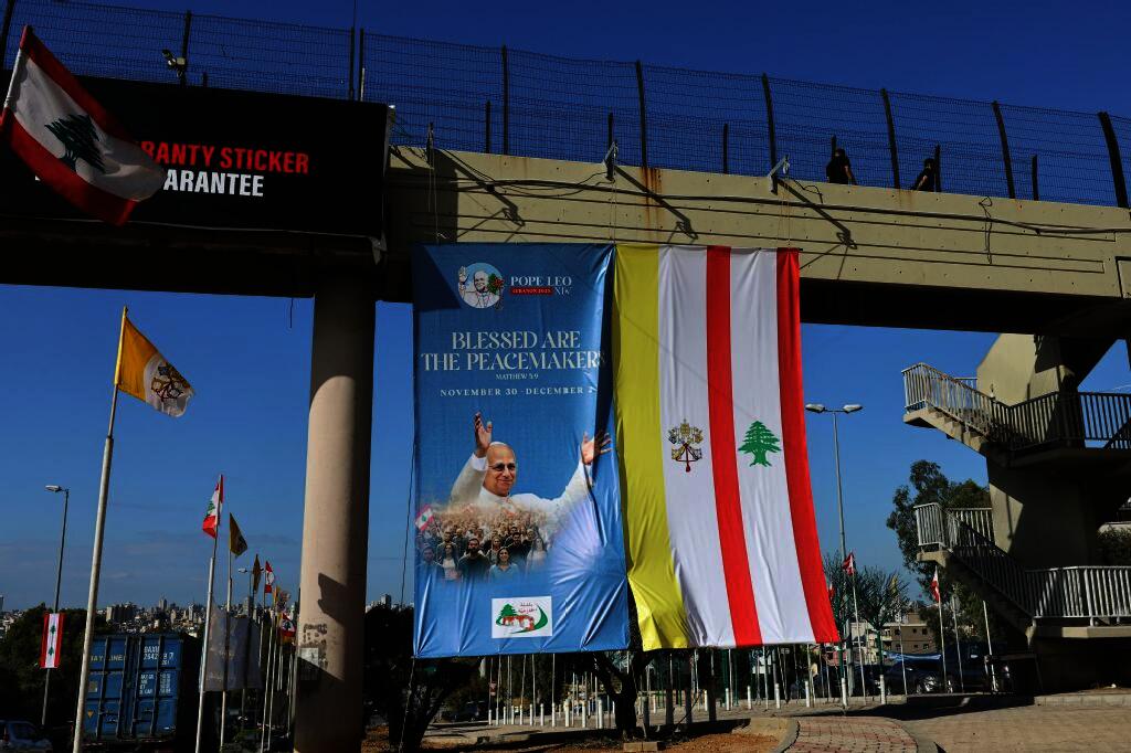 A portrait of Pope Leo XIV hangs in Hazmiyeh, east of Beirut ahead of his first trip abroad to Turkey and Lebanon. (AFP)