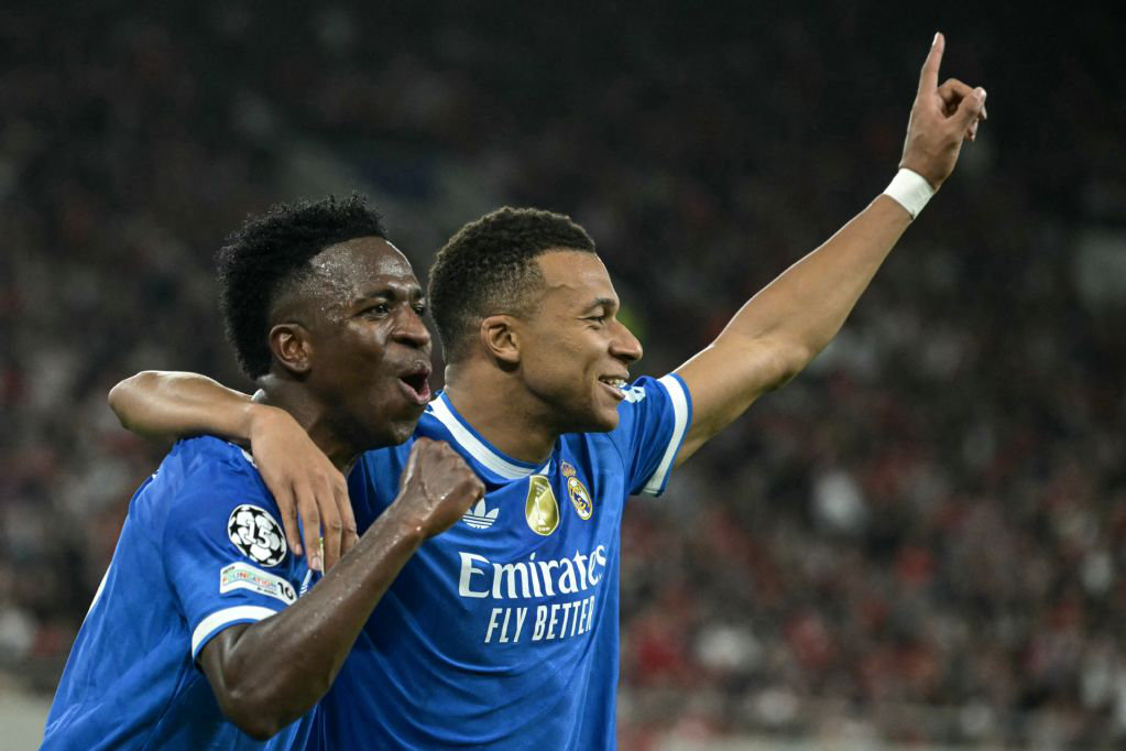 Real Madrid’s French forward Kylian Mbappe (R) celebrates with teammate Brazilian forward Vinicius Junior after scoring Real Madrid’s fourth goal during the UEFA Champions League, league phase - matchday 5, between Olympiakos (GRE) and Real Madrid (ESP) on Wednesday. (AFP)