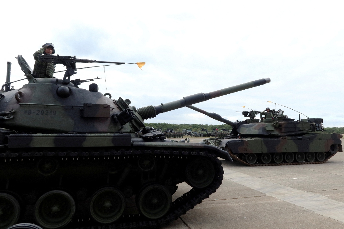A CM-11 Brave Tiger tank and an M1A2T Abrams tank take part in a commissioning ceremony for Taiwan's first battalion of M1A2T Abrams tanks, at the Hukou military base in Hsinchu, Taiwan. (Reuters)