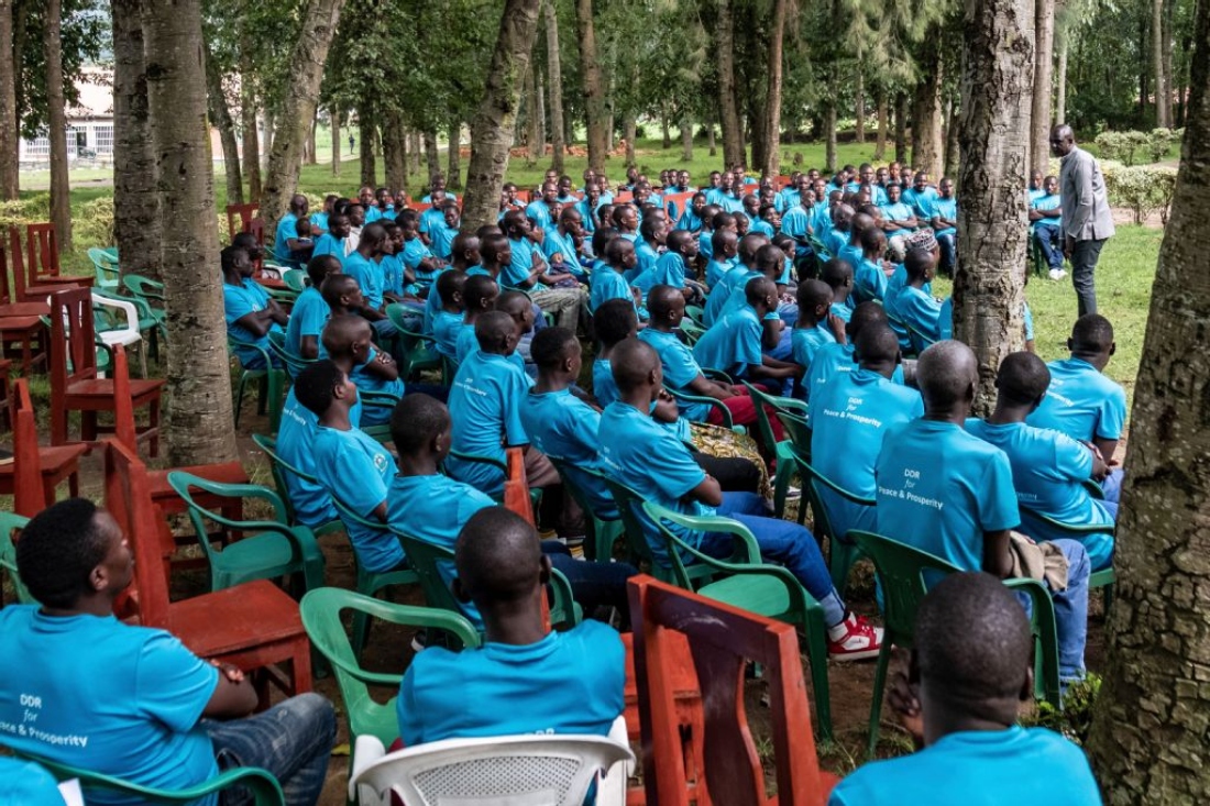 Cyprien Mudeyi, manager of the demobilization center for the Rwanda Demobilization and Reintegration Commission, speaks with former soldiers of Rwandan origin who previously fought in armed groups in eastern Democratic Republic of Congo during a counseling and experience-sharing session at the Mutobo Demobilization and Reintegration Resource Center in Ruhengeri. (AFP)