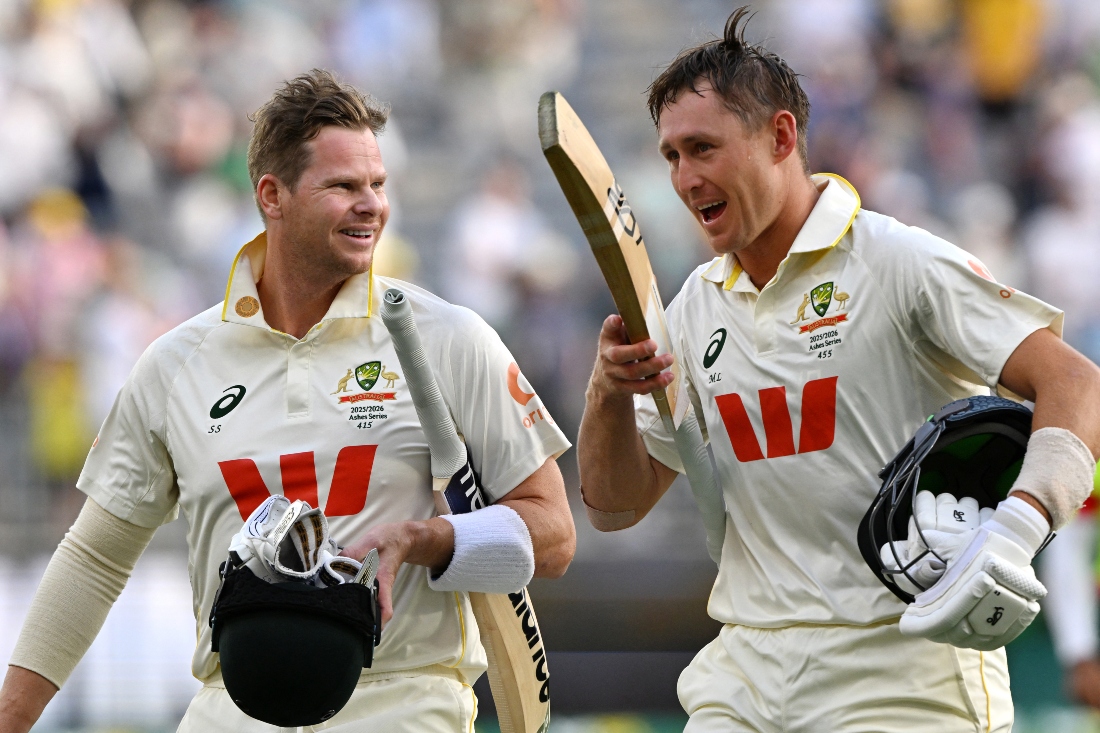 Australia’s Steve Smith (L) and Marnus Labuschagne following their team's victory in the first Ashes cricket Test match between Australia and England at Perth Stadium in Perth. (AFP)