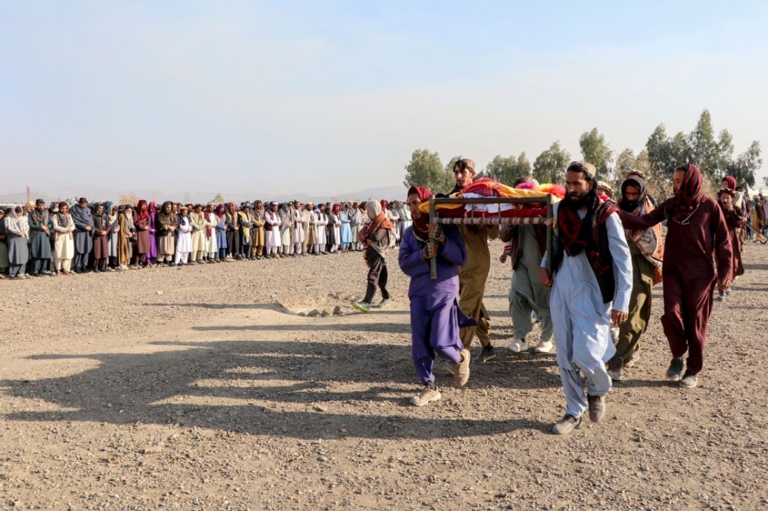 Afghan mourners and relatives of victims carry the coffin during a mass burial ceremony for nine children and one woman who were killed by a Pakistan air strike, in the Gurbuz district of Khost Province. (AFP)