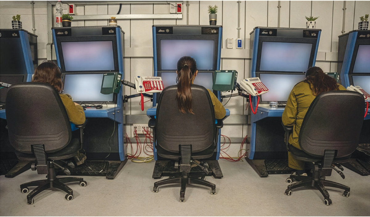 Soldiers are seen monitoring surveillance cameras at a command center at the IDF’s Re’im camp in southern Israel on November 5, 2023. (Israel Defense Forces)