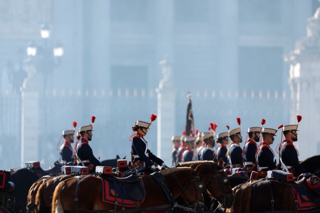Royal guards of cavalry parade during Germany's President welcome ceremony with military honors on the first day of a State visit to Spain. (AFP)
