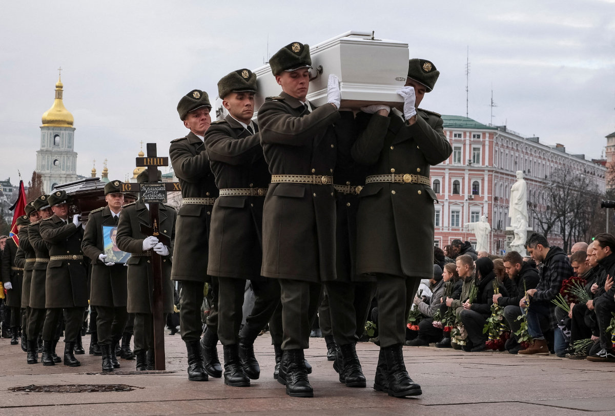 Ukrainian service members carry coffins with the body of their brothers-in-arms, who was recently killed in fighting against Russian troops, during a funeral ceremony in Kyiv, Ukraine, on November 28, 2025. (REUTERS)