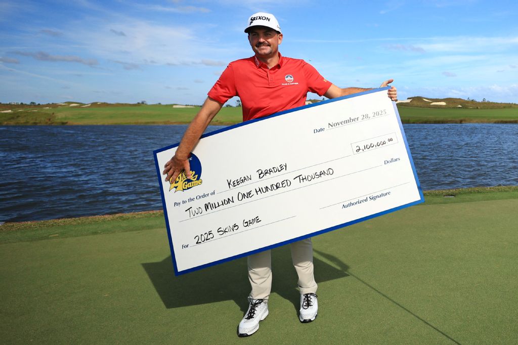 Keegan Bradley of the US celebrates with his check after winning The Skins Game at Panther National on Friday in Palm Beach Gardens, Florida. (Getty Images via AFP)