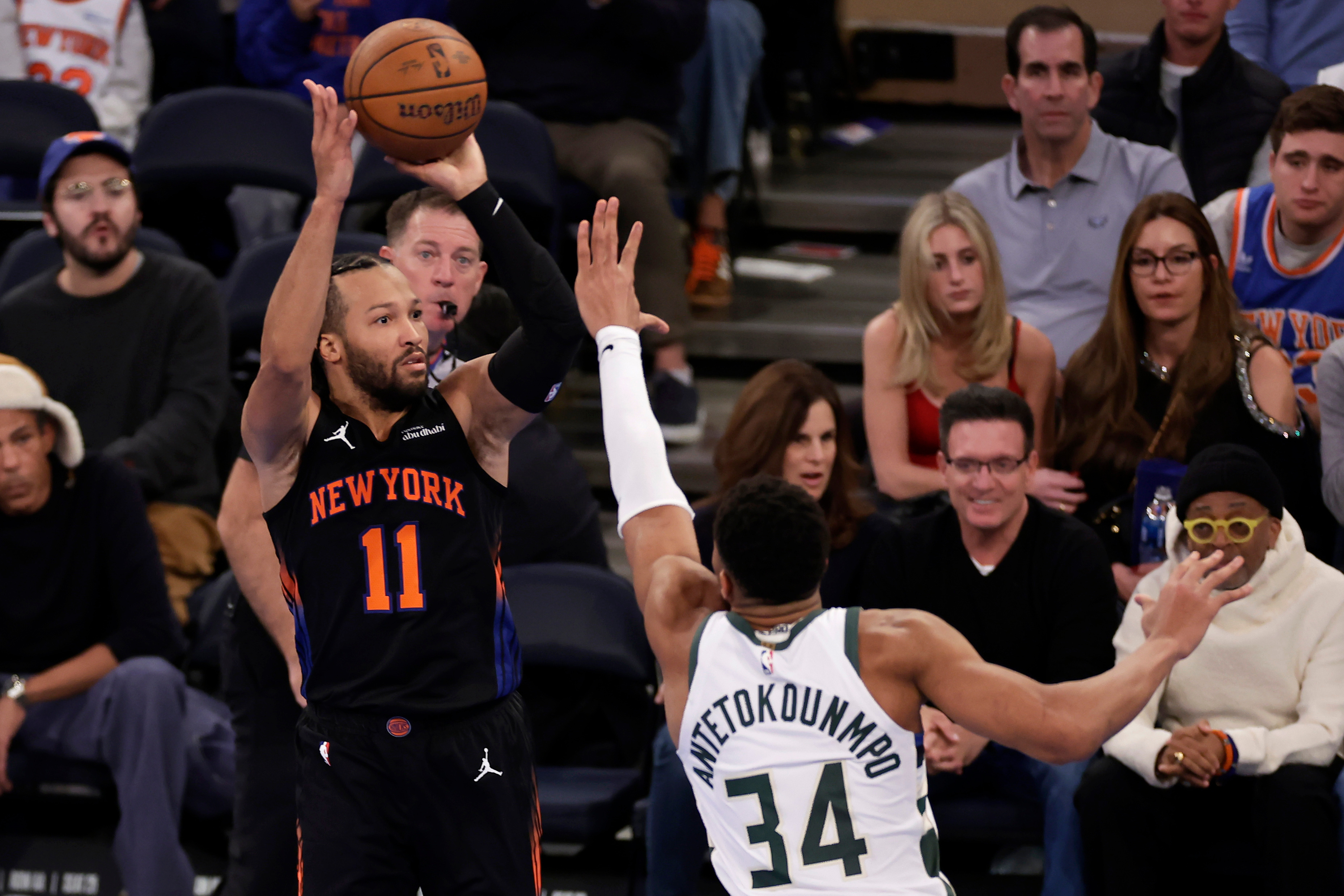 New York Knicks guard Jalen Brunson (11) shoots over Milwaukee Bucks forward Giannis Antetokounmpo during the second half of an NBA Cup basketball game Friday in New York. (AP)