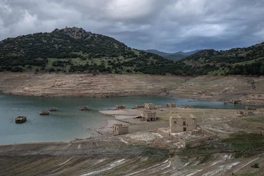 This photo shows the remnants of the houses that reappeared when the level of the Mornos artificial lake dropped following a drought, at the village of Kallio, Greece. (AFP)