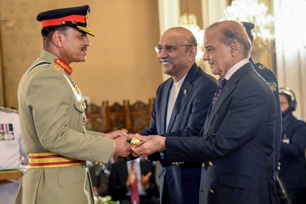 Chief of Army Staff Asim Munir, left, receives the Baton of Field Marshal from Pakistan’s Prime Minister Shehbaz Sharif, right, and President Asif Ali Zardari on May 22, 2025. (Pakistan’s Press Information Department/AFP)