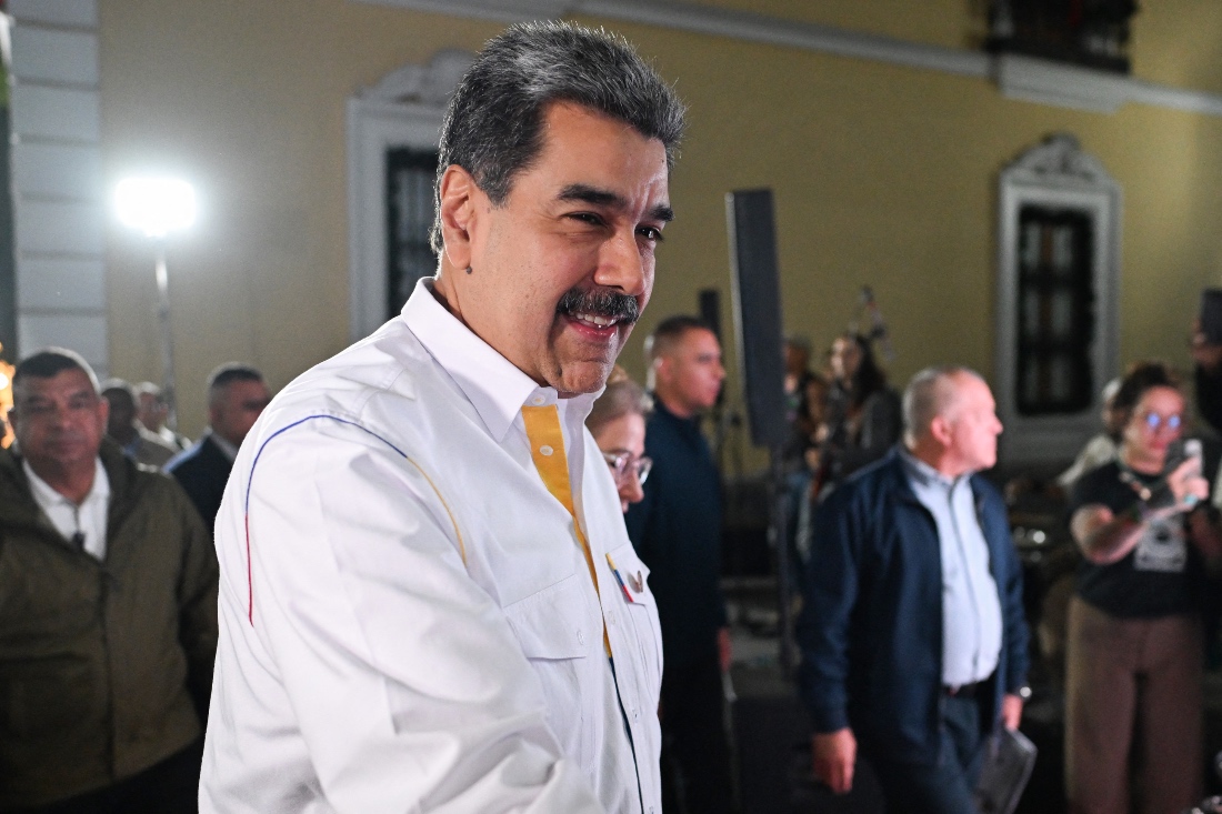 Venezuela's President Nicolas Maduro gestures as he arrives for the projection of a biographical series at the National Theatre of Venezuela in Caracas. (AFP)