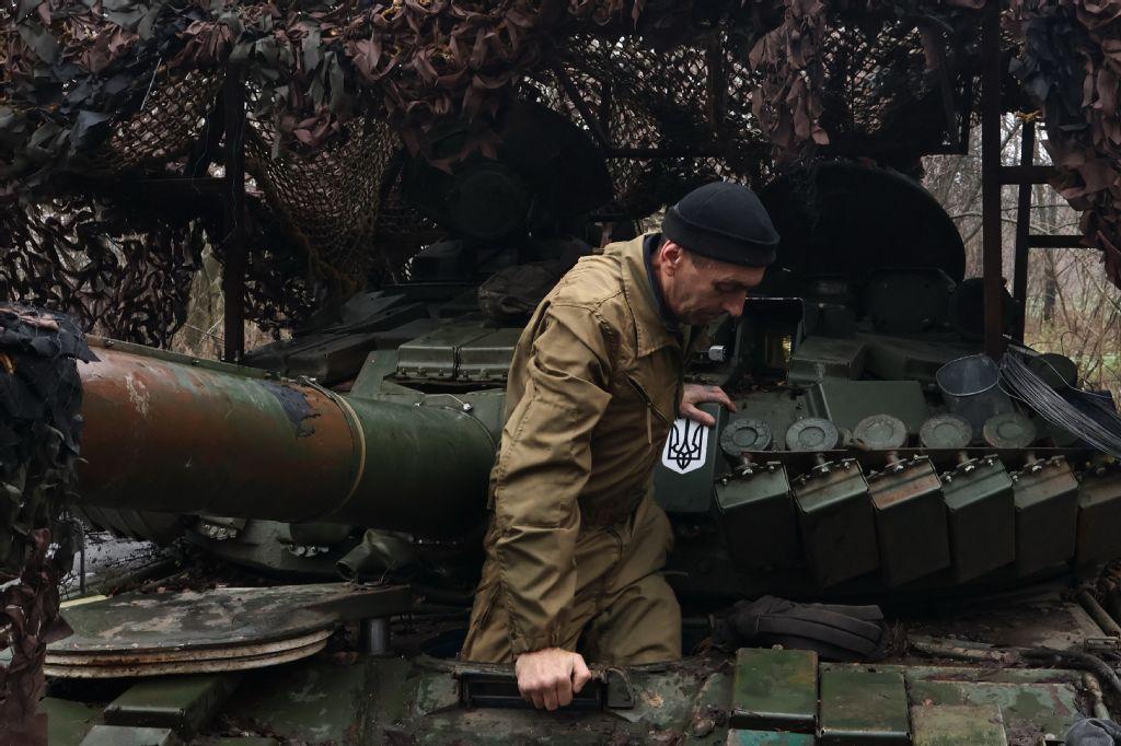 In this handout photograph taken on November 29, 2025 and released on November 30, 2025 by the press service of the 65th Mechanized Brigade of Ukrainian Armed Forces, a Ukrainian serviceman gets into a tank at an undisclosed location in Zaporizhzhia region, amid the Russian invasion of Ukraine. (AFP/65th Mechanized Brigade of Ukrainian Armed Forces/Andriy Andriyenko)