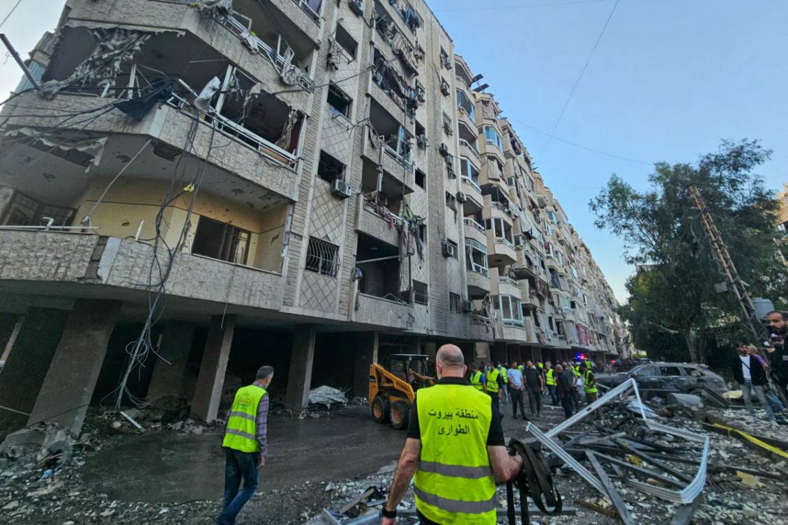 Lebanese emergency teams deploy near a damaged building at the site of Israeli strikes following evacuation orders, in Beirut's southern suburb on April 27, 2025. (AFP)