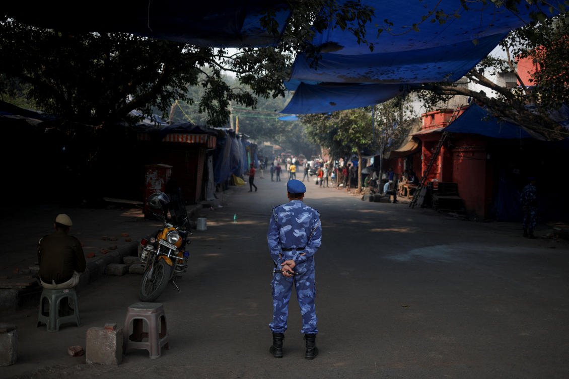 Above, a security personnel stands guard at a closed market area near the site of an explosion, near the historic Red Fort in the old quarters of Delhi on Nov. 12, 2025. (Reuters)