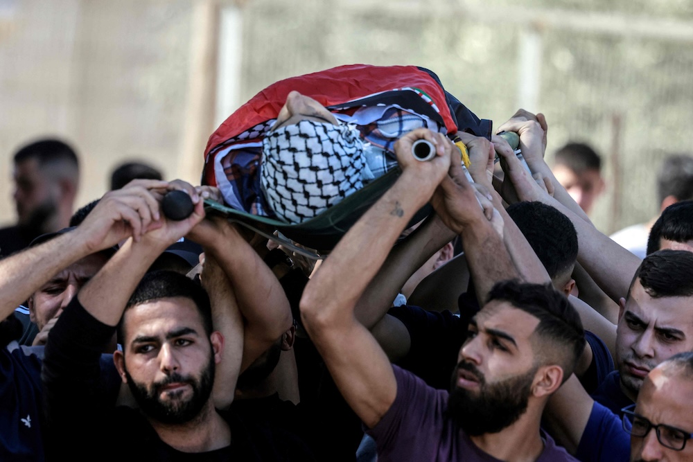Mourners carry the body of Yamen Hamed during his funeral in West Bank on Oct. 31, 2025. (AFP)