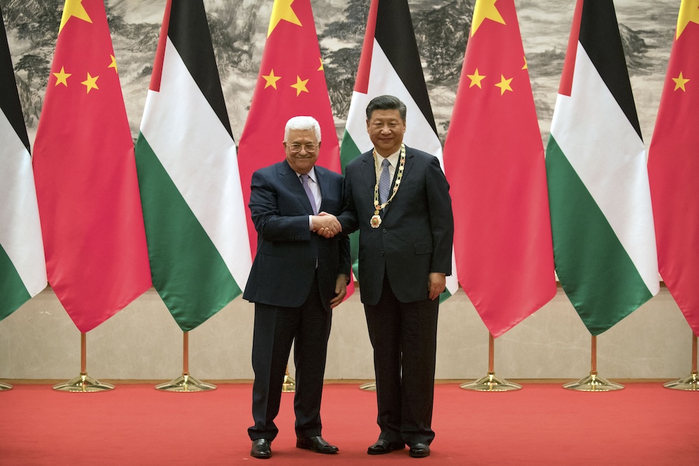 Chinese President Xi Jinping welcomes Palestinian President Mahmoud Abbas in Beijing on July 18, 2017. (AFP)