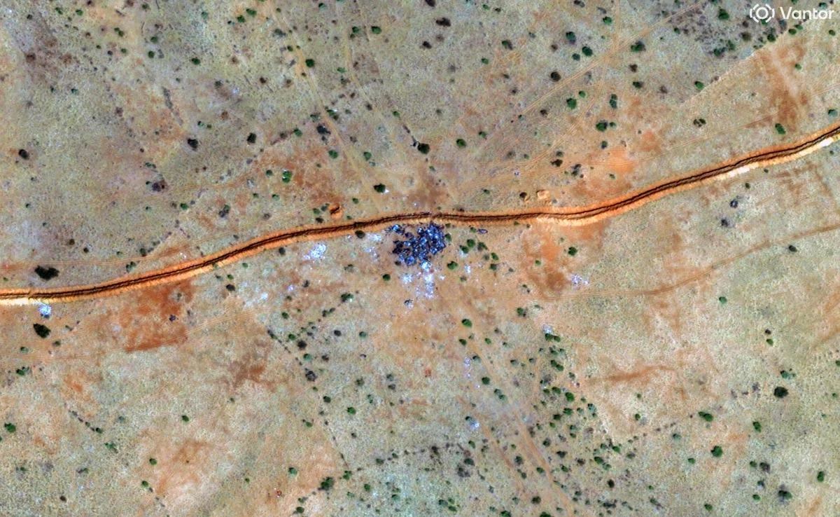 This handout satellite image by Vantor taken on October 30, 2025 and made available on October 31, 2025 shows a general view of burnt vehicles along the berm northwest of El-Fasher. (AFP)
