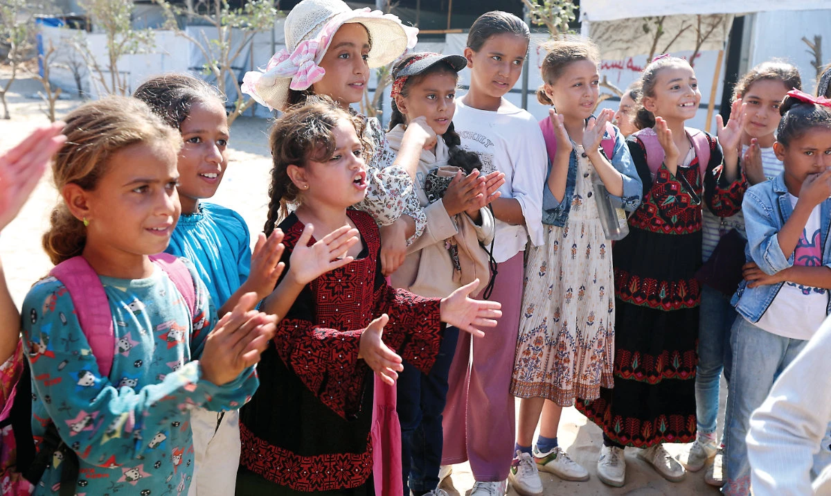 Palestinian children take part in recreational activities organized by members of the Palestinian Red Crescent Society in Khan Younis. (Reuters)