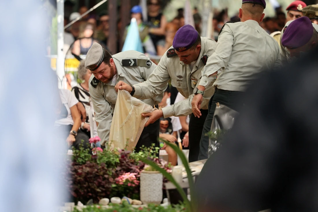 Members of the military attend the funeral of retrieved hostage, Israeli soldier Colonel Asaf Hamami, a brigade commander, at the Kiryat Shaul cemetery in Tel Aviv, Israel. (Reuters)