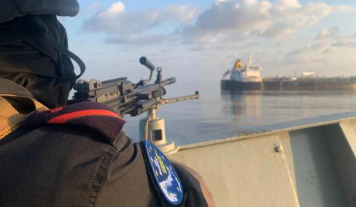 A member of the European Union's Operation Atalanta mans a machine gun aboard the ESPS Victoria while watching the Hellas Aphrodite off the coast of Somalia in the Arabian Sea on Friday, Nov. 7, 2025. (AP)
