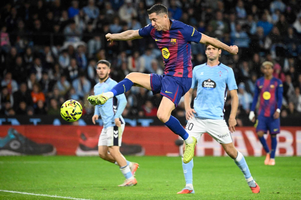 Barcelona’s Polish forward Robert Lewandowski scores his second goal during the Spanish league football match between RC Celta de Vigo and FC Barcelona at Balaidos Stadium in Vigo on Nov. 9, 2025. (AFP)