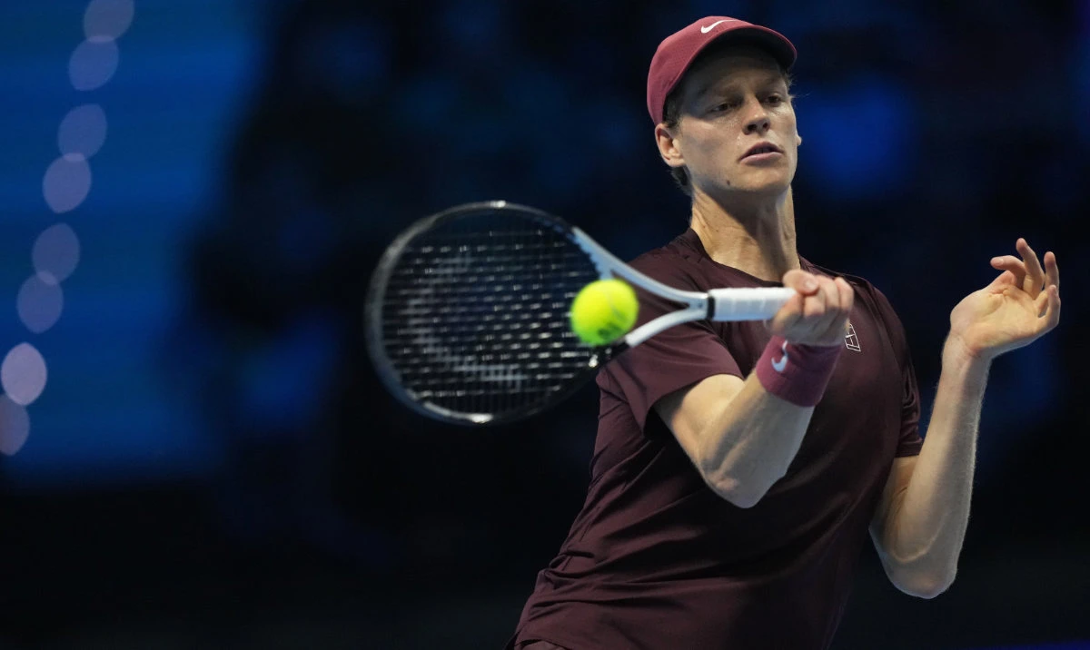 Italy's Jannik Sinner returns the ball to Canada's Felix Auger-Aliassime during their tennis match of the ATP World Tour Finals, in Turin, Italy, Monday, Nov. 10, 2025. (AP)