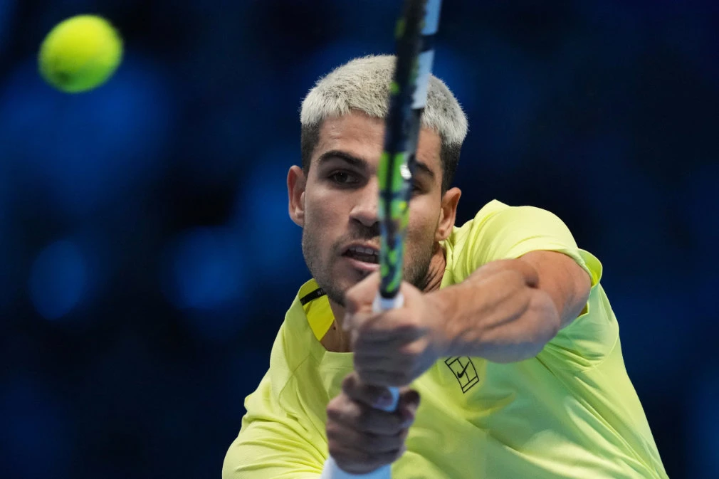 Spain’s Carlos Alcaraz returns the ball to US’ Taylor Fritz during their tennis match of the ATP World Tour Finals in Turin, Italy Tuesday. (AP)