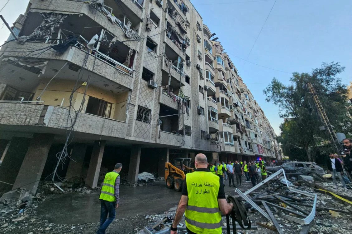 Lebanese emergency teams deploy near a damaged building at the site of Israeli strikes following evacuation orders, in Beirut's southern suburb on April 27, 2025. (AFP)
