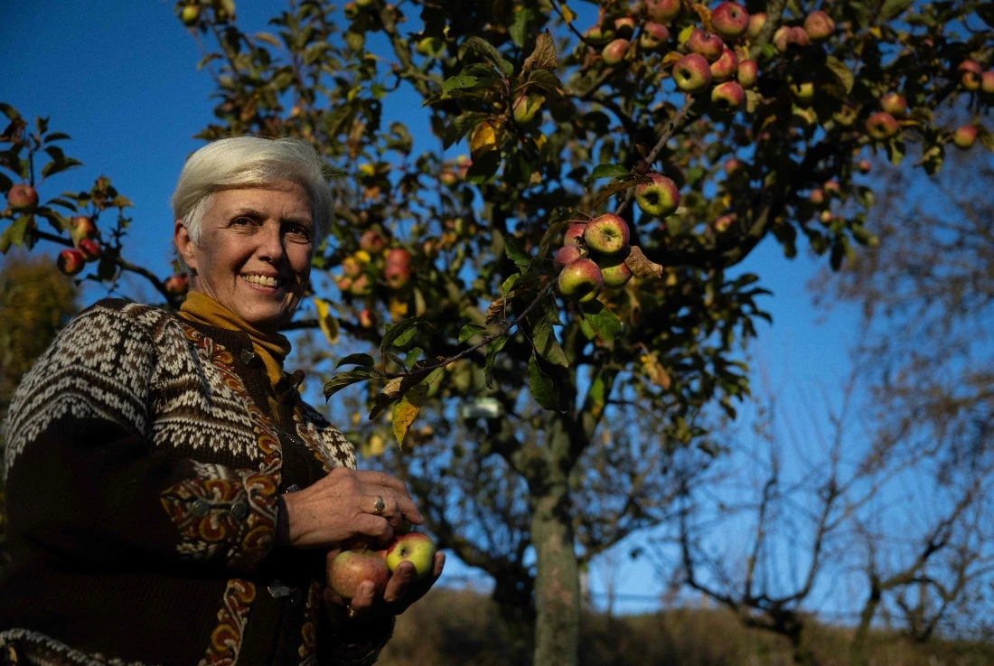 Italian agronomist and researcher Isabella Dalla Ragione poses in the orchard collection of the Archeologia Arborea foundation in San Lorenzo di Lerchi, a hamlet of Città di Castello in Umbria. (AFP)
