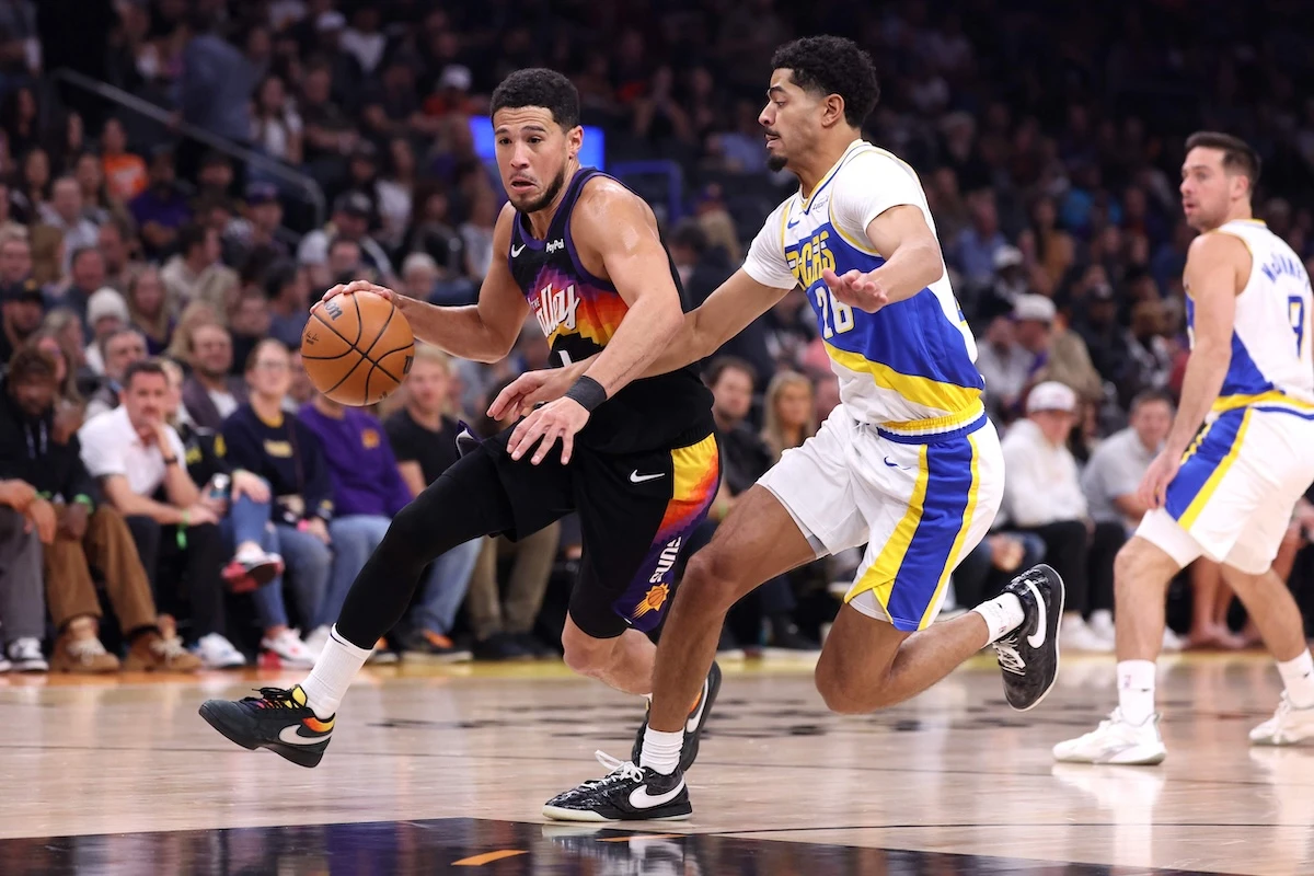 Devin Booker of the Phoenix Suns drives to the basket against Ben Sheppard of the Indiana Pacers during the first half of an NBA game at Mortgage Matchup Center on Thursday in Phoenix, Arizona. (Getty Images via AFP)