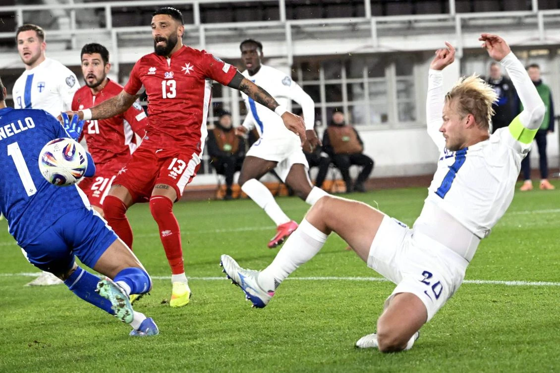 Malta’s goalkeeper Henry Bonello (L) tries to stop Finland’s forward Joel Pohjanpalo (R) during their 1st round — day 9 — Group G World Cup 2026 European Qualifiers match on Nov. 14, 2025 in Helsinki. (AFP)