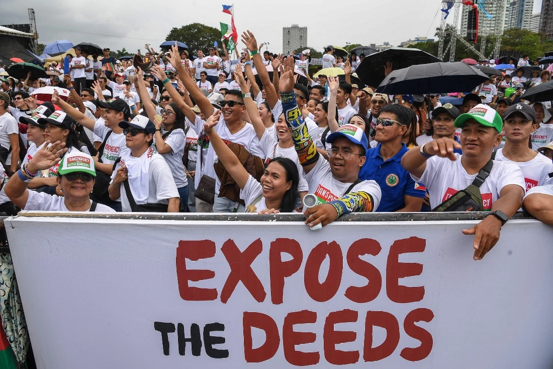 Members of religious group Iglesia ni Cristo attend an anti-corruption protest at a park in Manila, Philippines. (AFP)