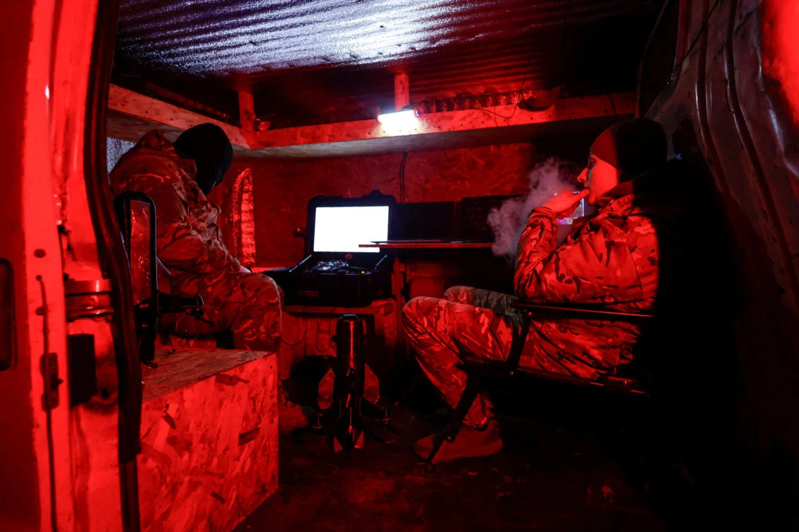 Ukrainian an air-defense service members wait inside a van during their combat shift near the frontline town of Kupiansk in Kharkiv region on Nov. 14, 2025. (Reuters)