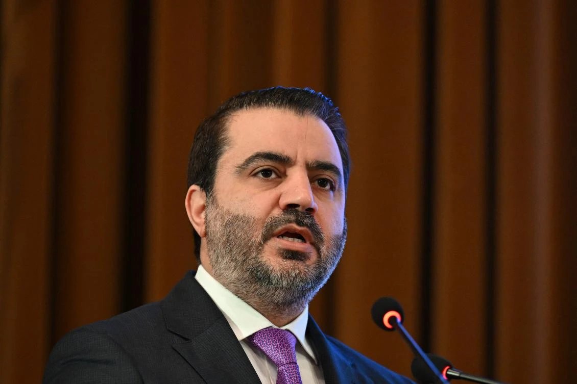 Syrian Minister of Foreign Affairs and Expatriates Asaad Al-Shaibani addresses delegates during a day of dialogue with Syrian civil society. (Photo by LOUAI BESHARA / AFP)