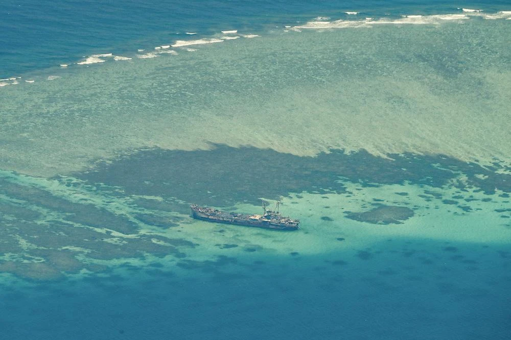 Above, an aerial view taken on March 9, 2023 shows Philippine ship BRP Sierra Madre grounded on Second Thomas Shoal in the South China Sea. (AFP file photo)