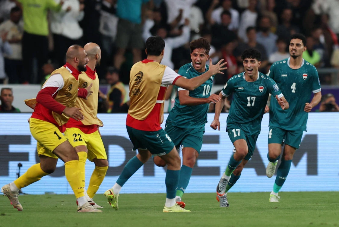 Iraq’s Mohannad Ali celebrates scoring their first goal with teammates during their FIFA World Cup — AFC Qualifiers — Play Off — Second Leg — against UAE — Basra International Stadium, Basra, — Nov. 18, 2025. (Reuters)