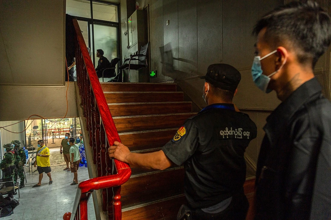 Members of the Karen Border Guard Force (BGF) carry out an inspection at a work place during a crackdown operation on illicit activity linked to scam centres in Shwe Kokko in Myanmar's eastern Myawaddy township. (AFP)