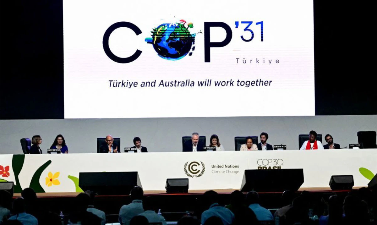 A screen shows the COP31 logo organized by Turkiye and Australia during the COP30 UN Climate Change Conference in Belem, Para state, Brazil on November 22, 2025. (AFP)